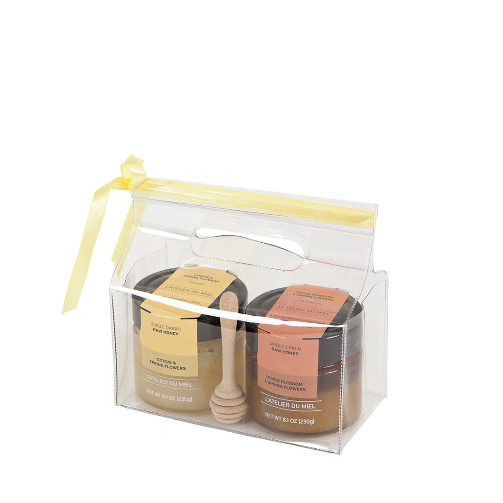 A reusable bag with a selection of 2 small honey jars